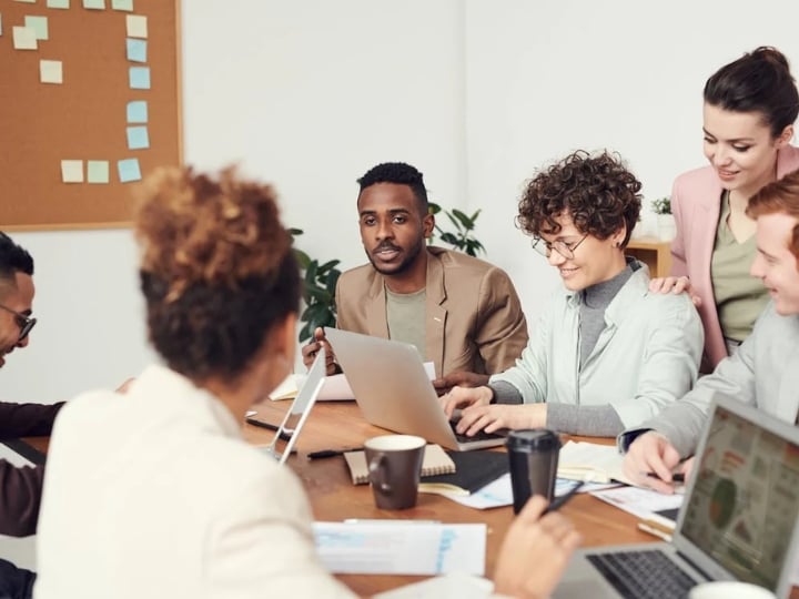 A diverse group of professionals engaged in a productive meeting in a conference room