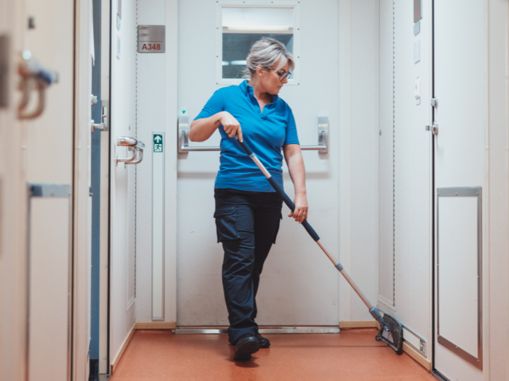 Sodexo employee mopping the floor