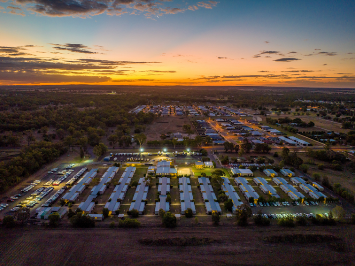 Aerial view of a remote camp at sunset