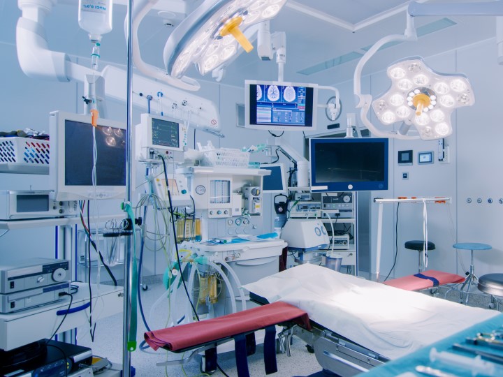 An operation room at a hospital, full of medical devices and supplies