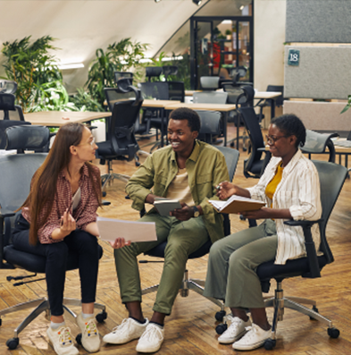 Three professionals having a discussion in an office setting