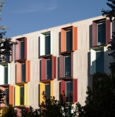 A building adorned with numerous windows and colorful shutters