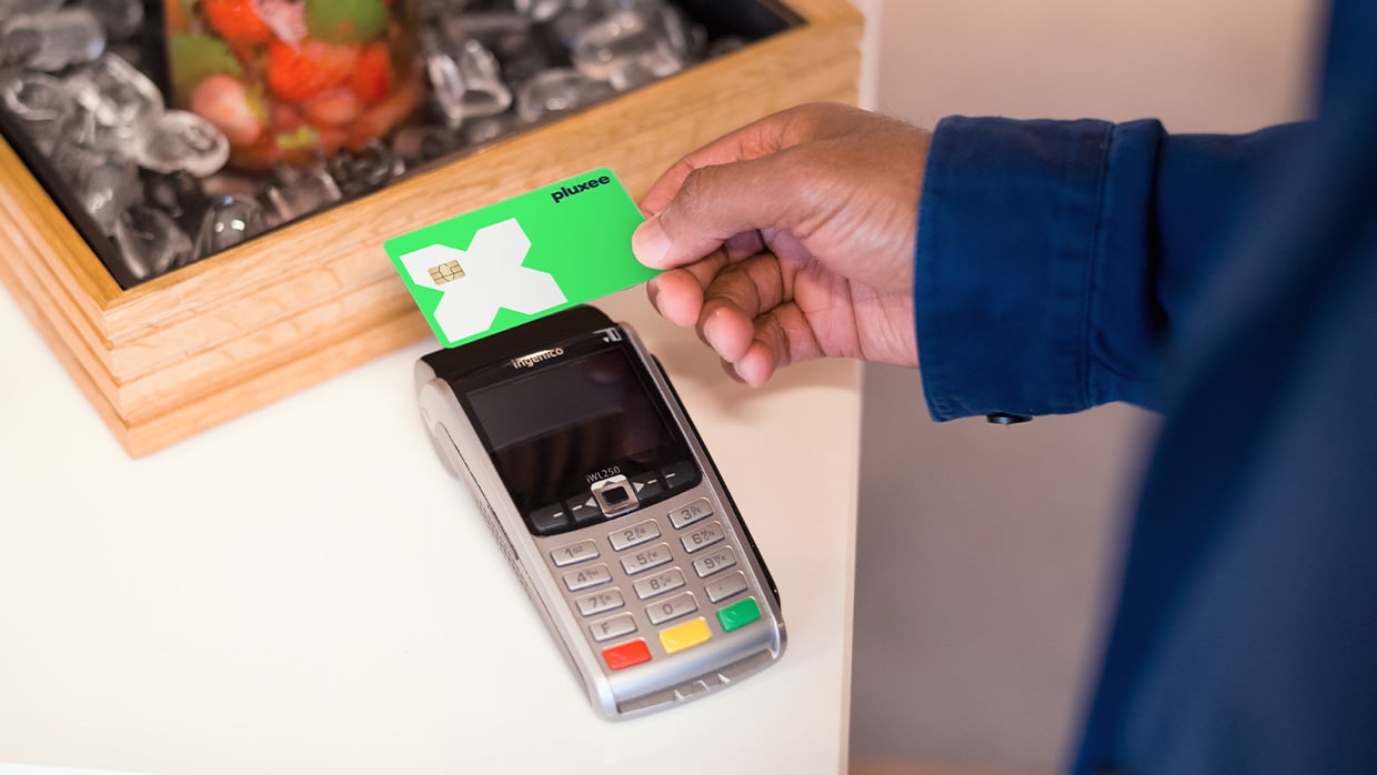 Person using Pluxee card