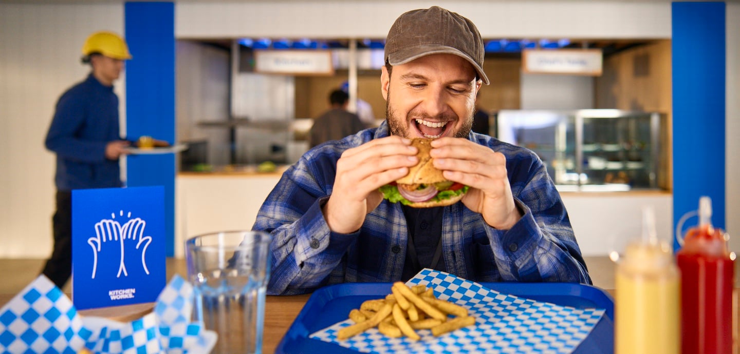 man eating a burger