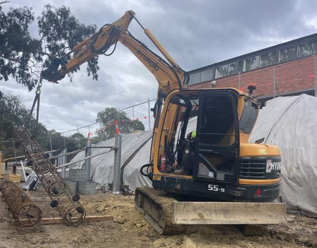 Image of retaining wall piles and posts installed at Alphington Link