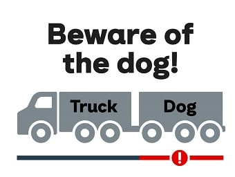 Image of a truck and trailert with the words Beware of the dog