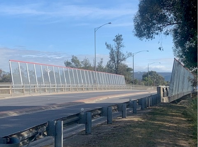 View of the completed public safety barriers from the Melrose Drive overpass
