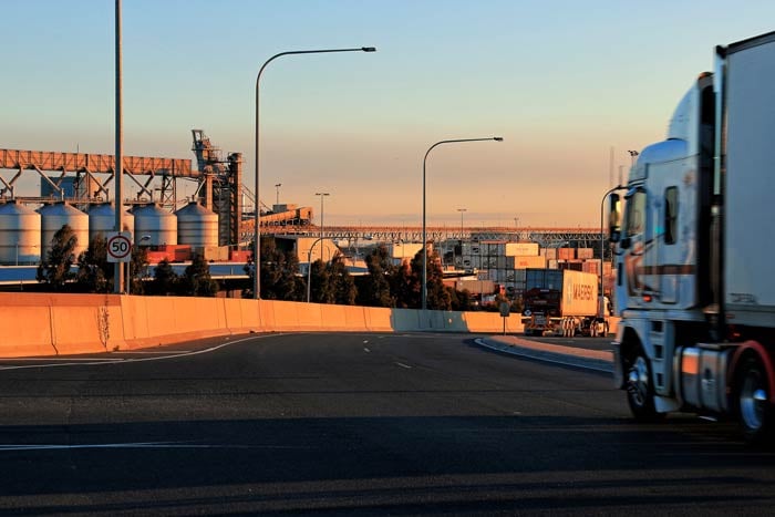 Trucks driving at dusk