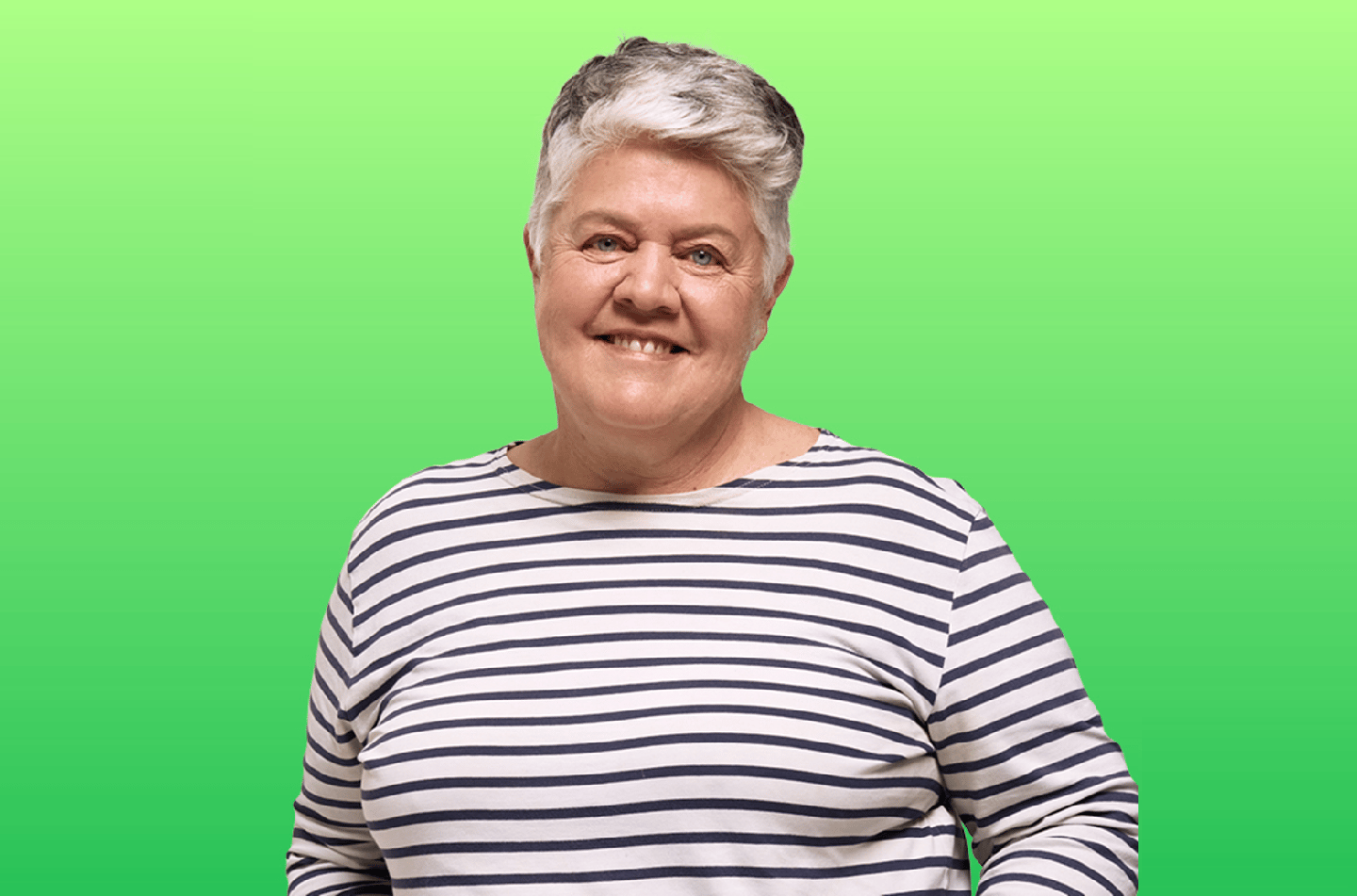 Image of a lady wearing a black and white horizontal striped top in front of a green screen