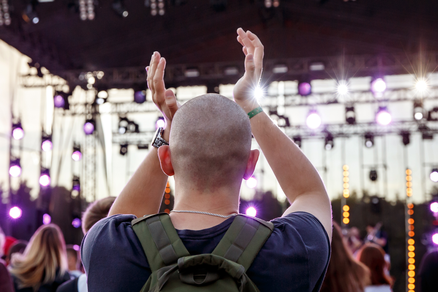 Image of a rock concert patron clapping his hands