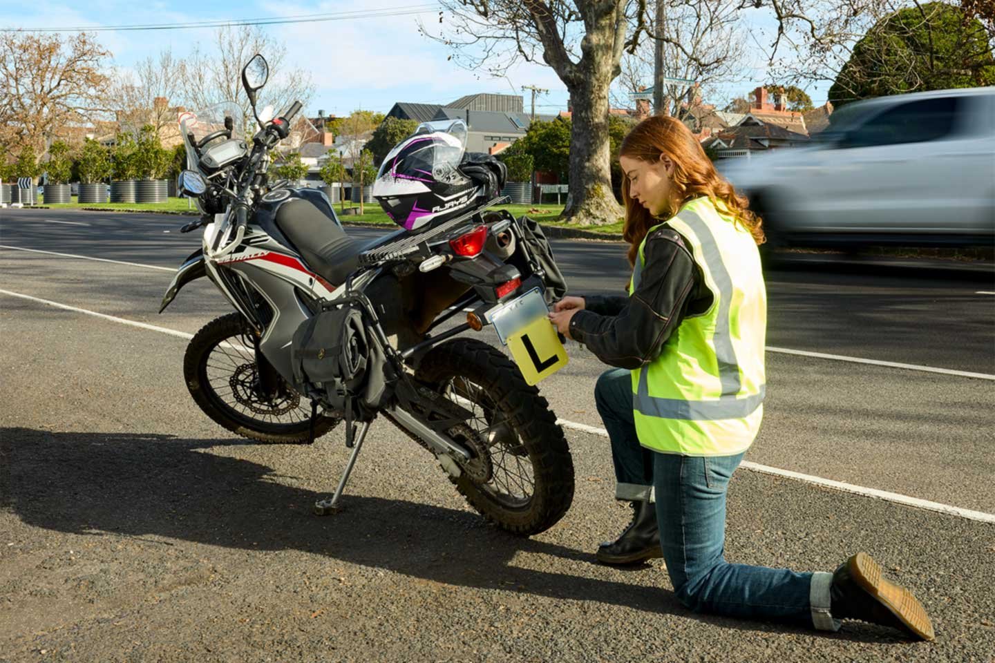 learner-motorcycle-woman-hi-vis