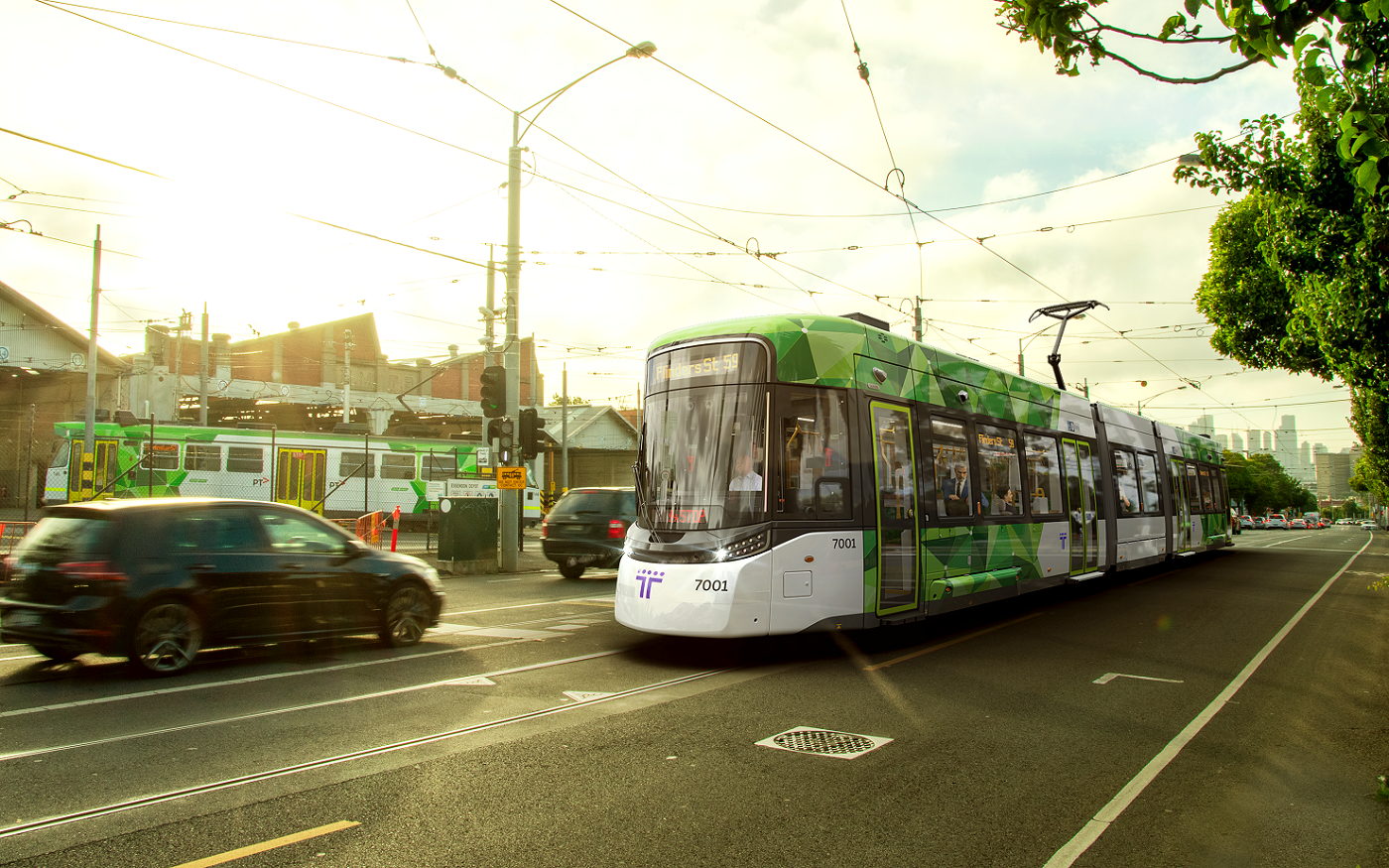 Image of a next generation tram on tracks near a depot