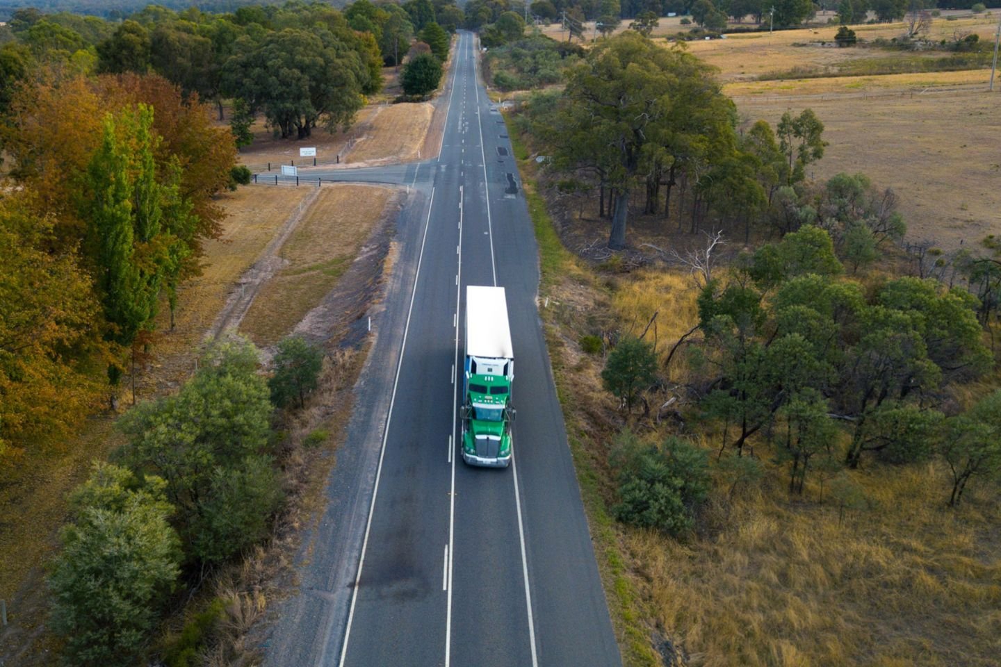 A truck driving along a rural road.