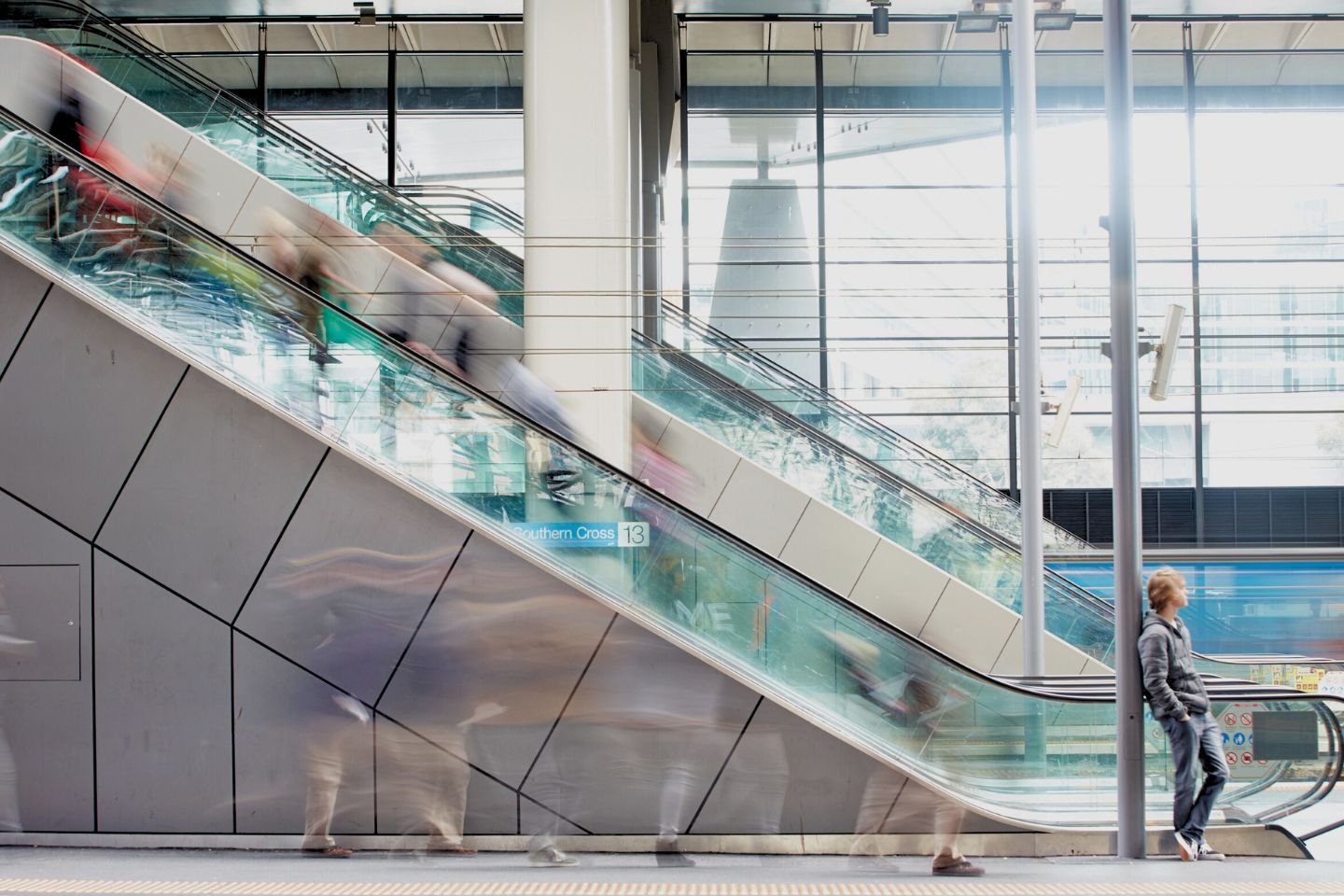 Side view of escalators down to a platform at Southern Cross Station.