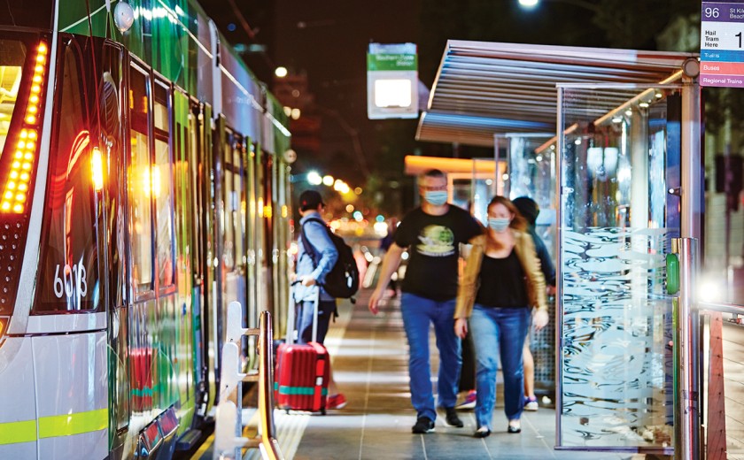passengers-boarding-tram-at-night