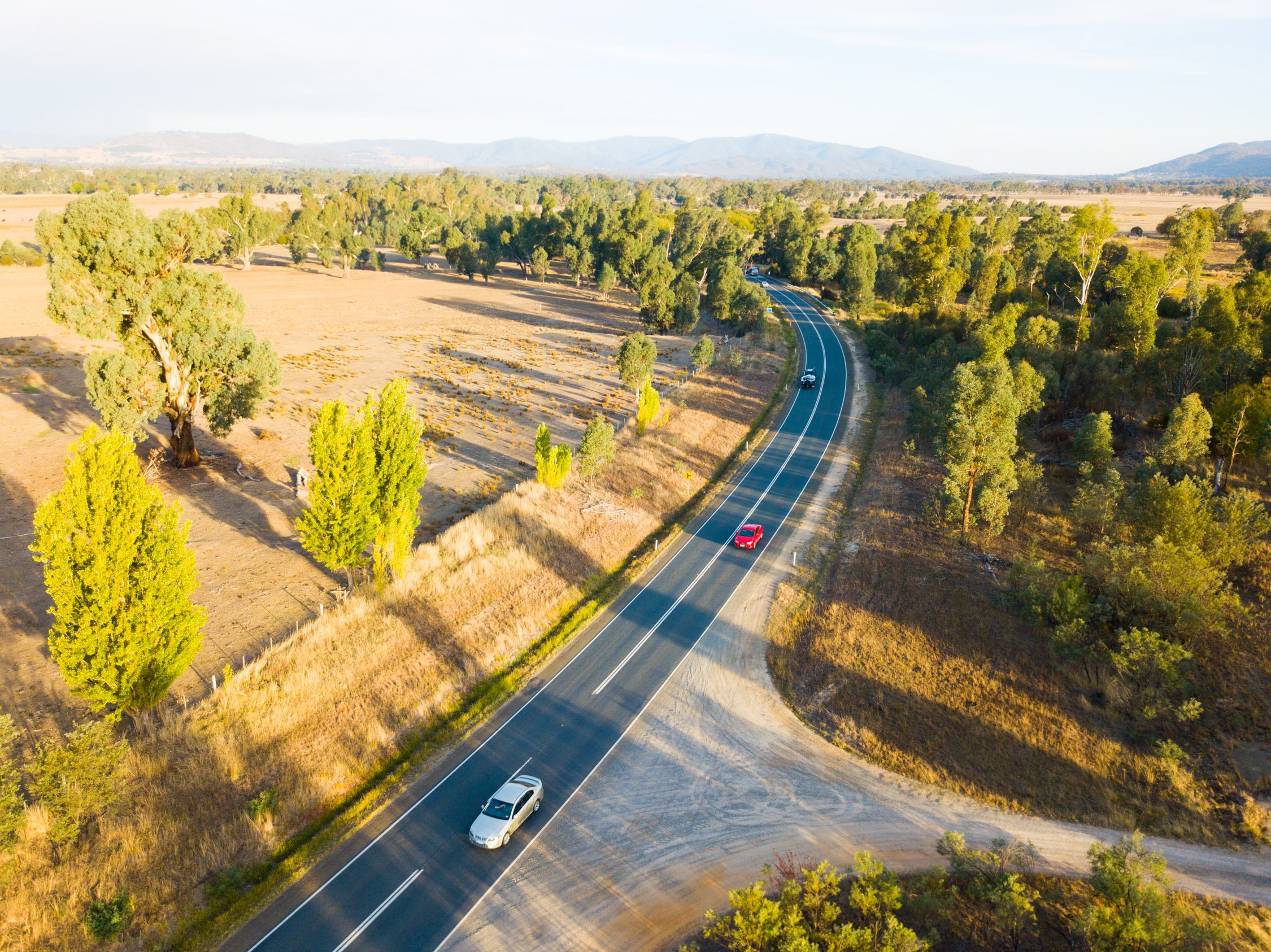 rural-highway-dirt-road-cars