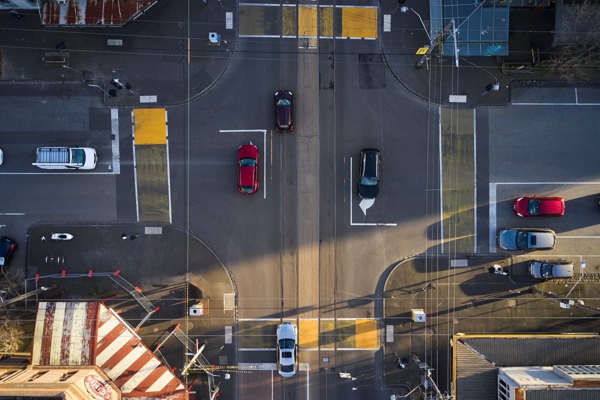 Overhead photo of cars at a four-way intersection