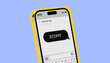 Image of a mobile phone with the words STOP IT