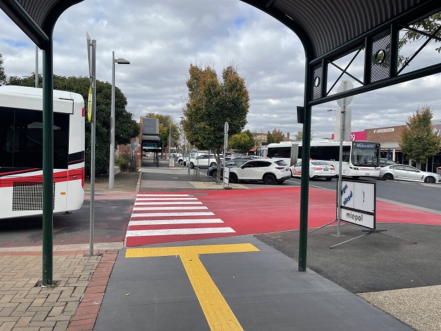 Image of red and white pedestrian crossing at the Sunbury station bus interchange