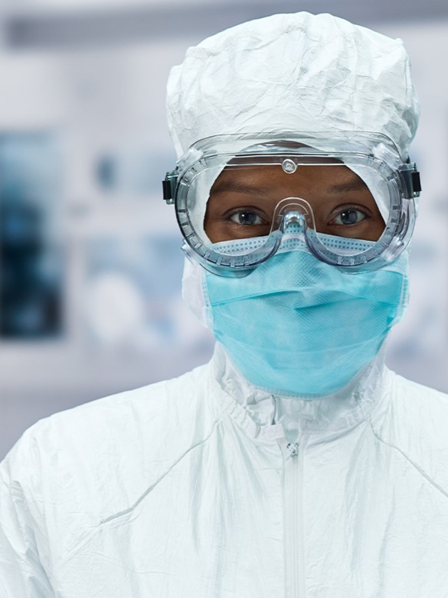 woman in cleanroom full PPE