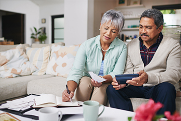 Compare your estimated earnings with your retirement goals to help determine what age would be best for you and your spouse to retire, even if it is at different times.