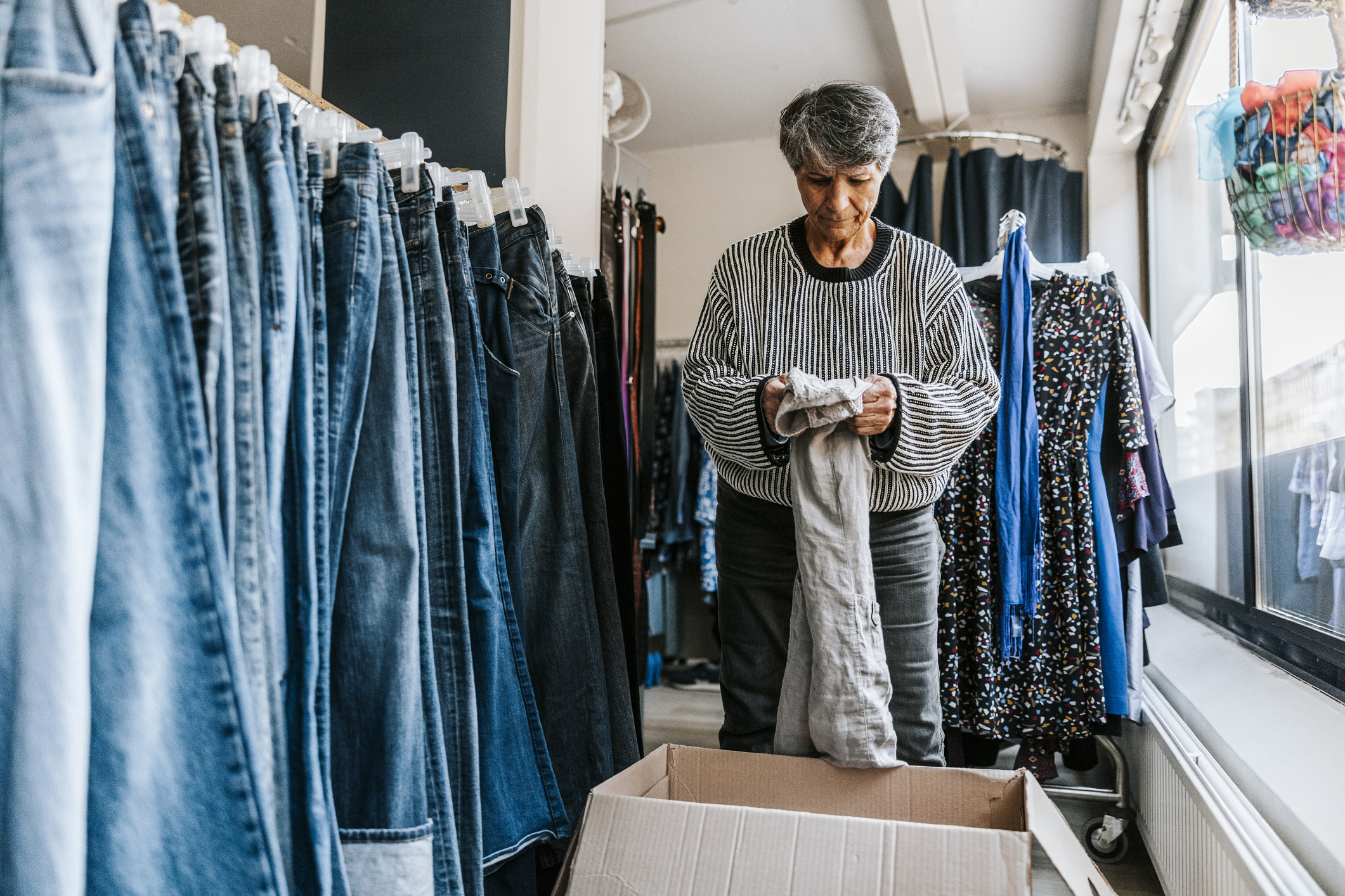 older-woman-working-at-thirft-store