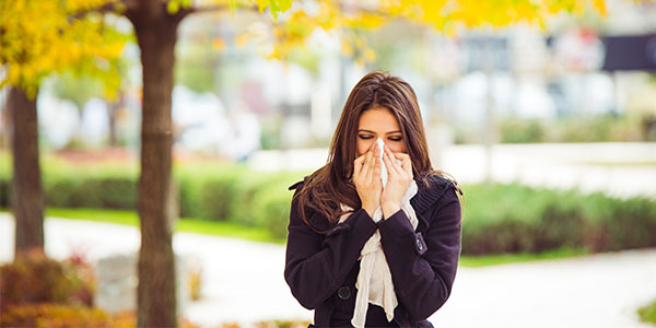 young-woman-blowing-nose-600x300