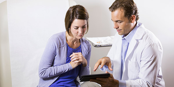 Woman with dermatologist