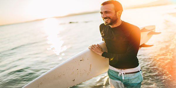 Caucasian Male Holding Surfboard
