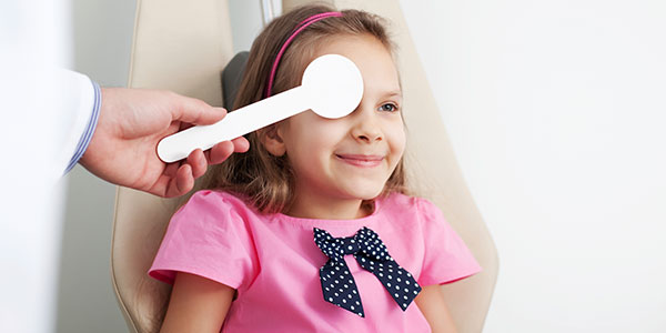 Girl having eye exam