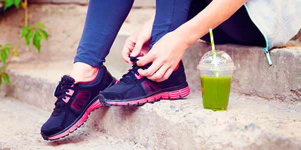 Woman tying running shoes