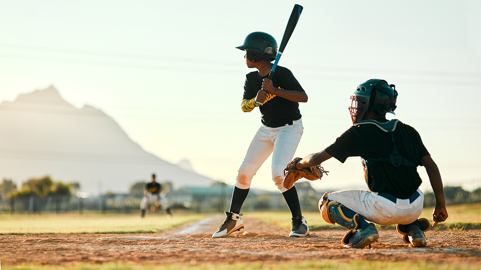 little league baseball player ready to swing bat