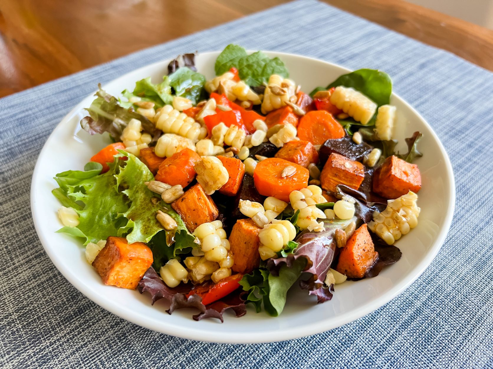 Roasted vegetable salad on a white plate