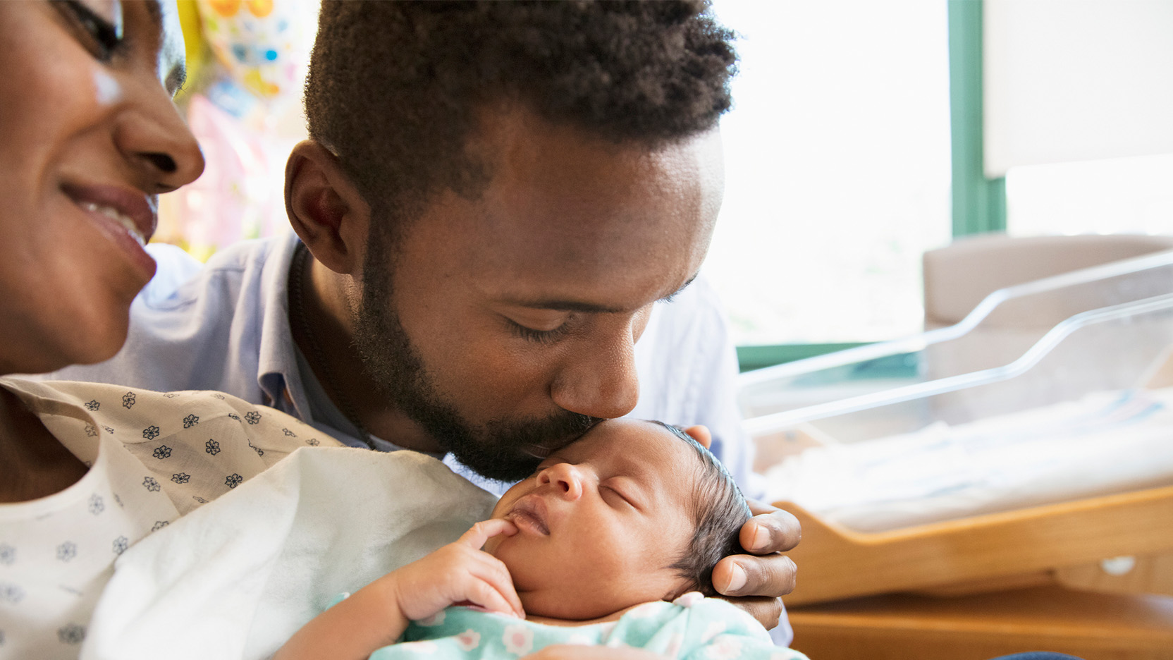Parents with newborn at hospital room