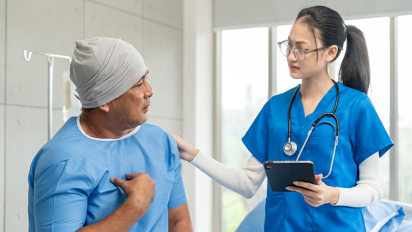 A patient discusses cancer treatment side effects with an oncologist.