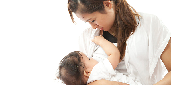 Asian mother breastfeeding baby
