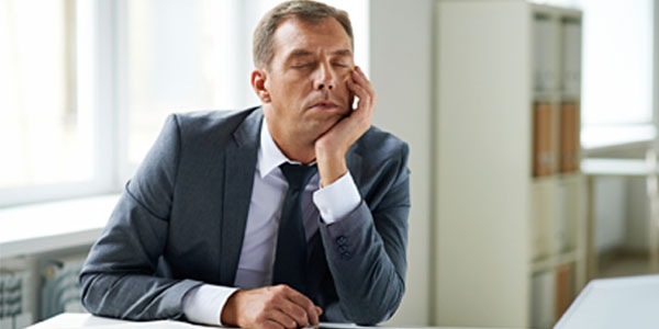 Man asleep at office desk
