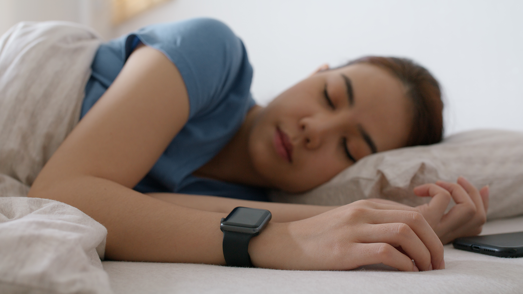 Girl sleeping with wearable technology