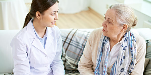 Female doctor and patient having conversation