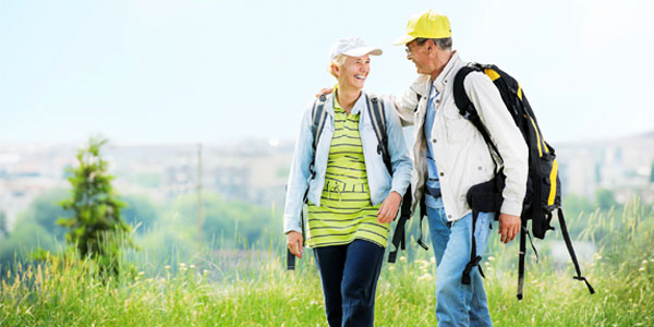 Mature couple walking in park