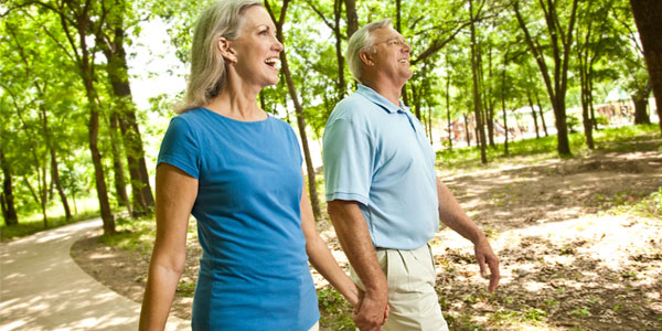 Couple walking in park