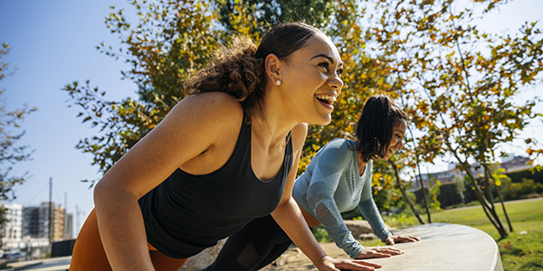 two-women-exercising-together
