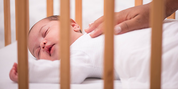 Baby sleeping in crib