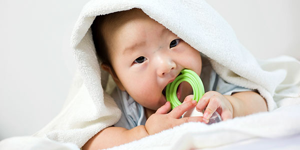 Baby with teething ring