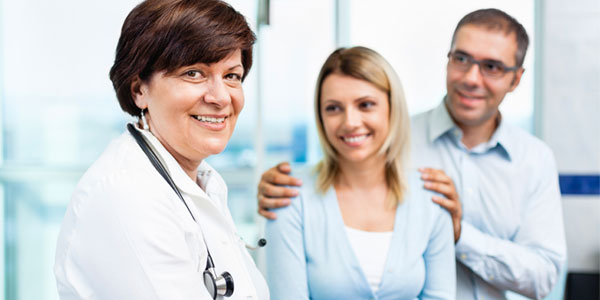 Young couple with doctor
