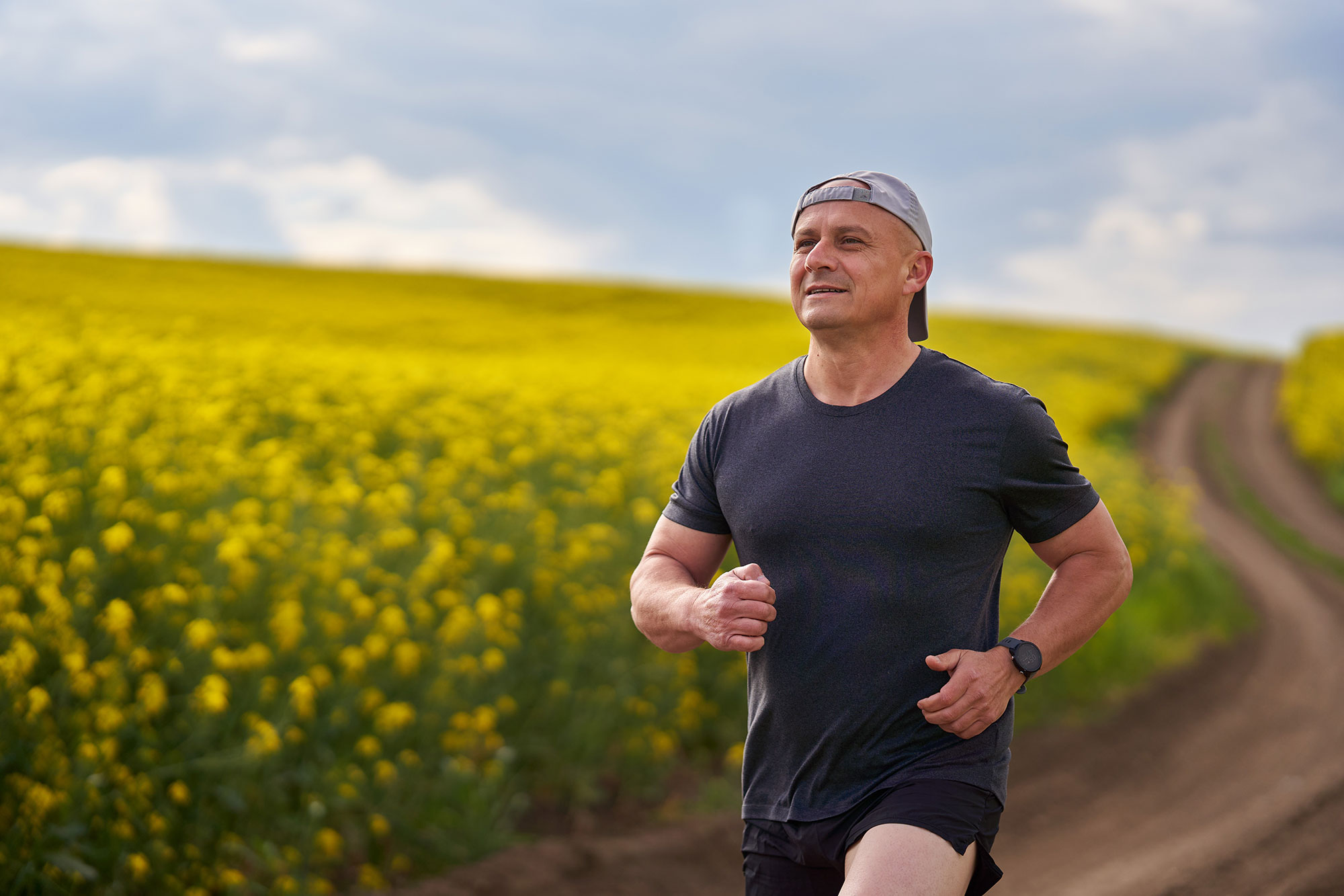 Middle aged man jogging outdoors