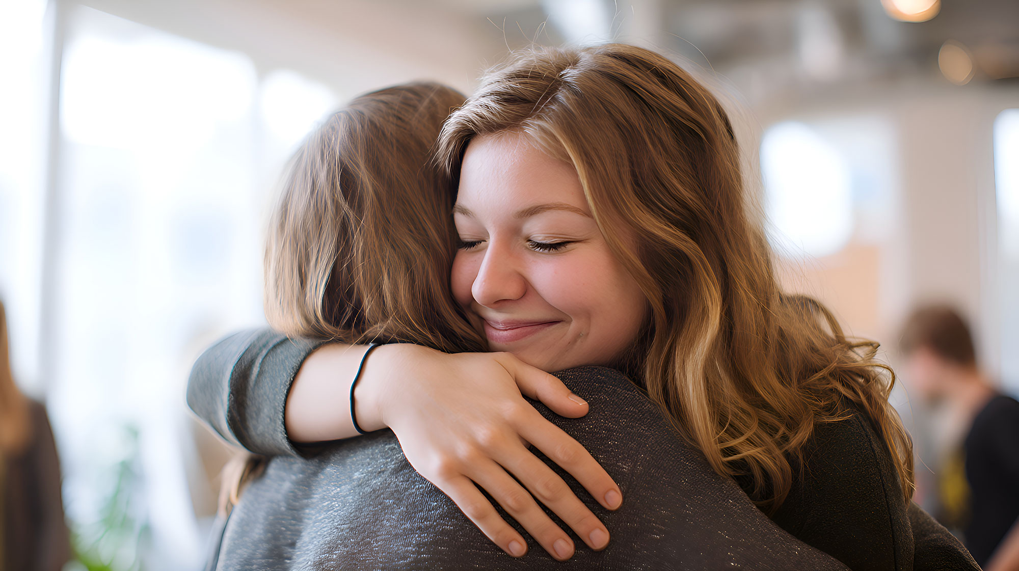 Two friends hugging in restaurant