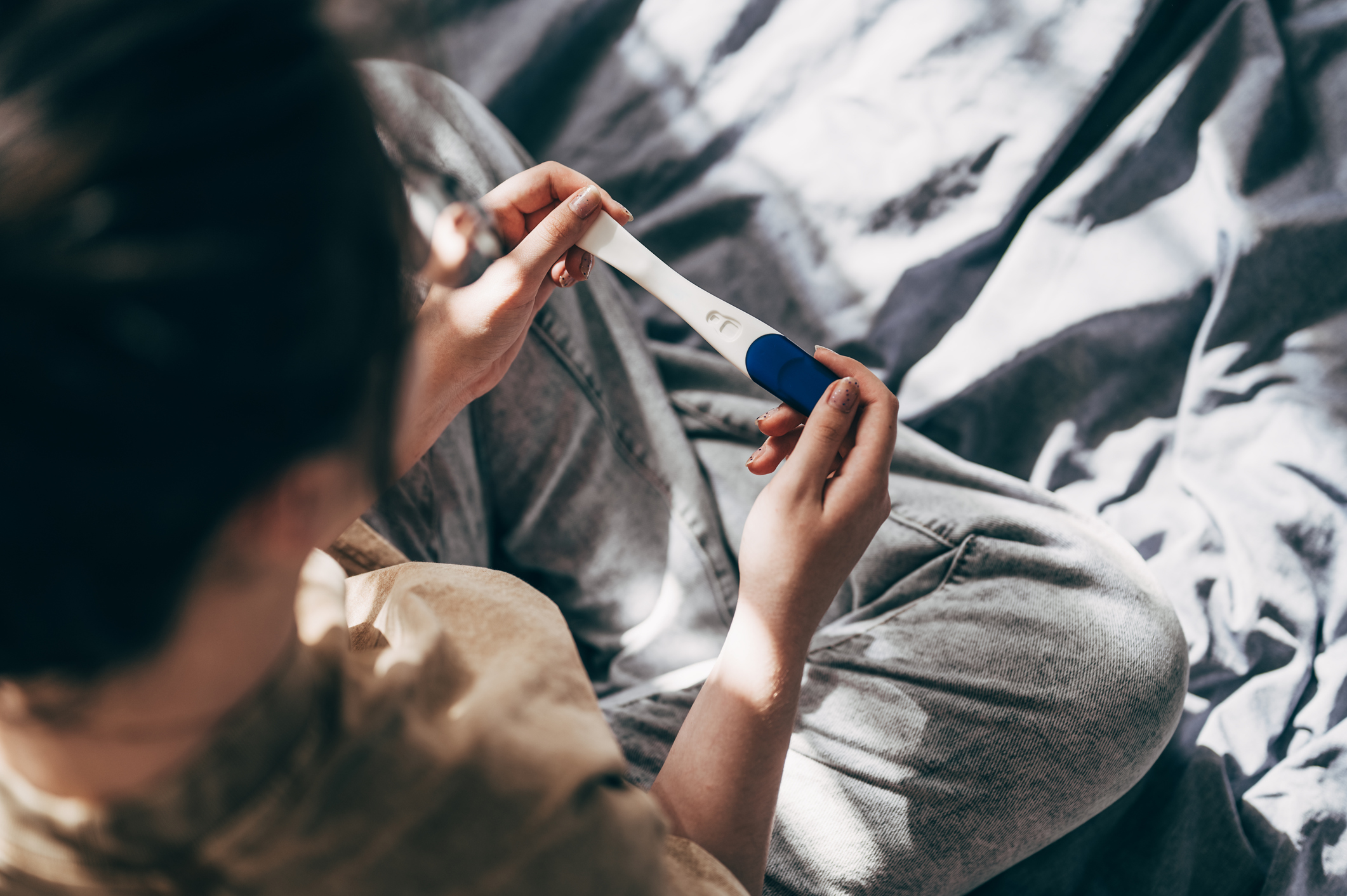 pregnancy-test-mom-looking-down