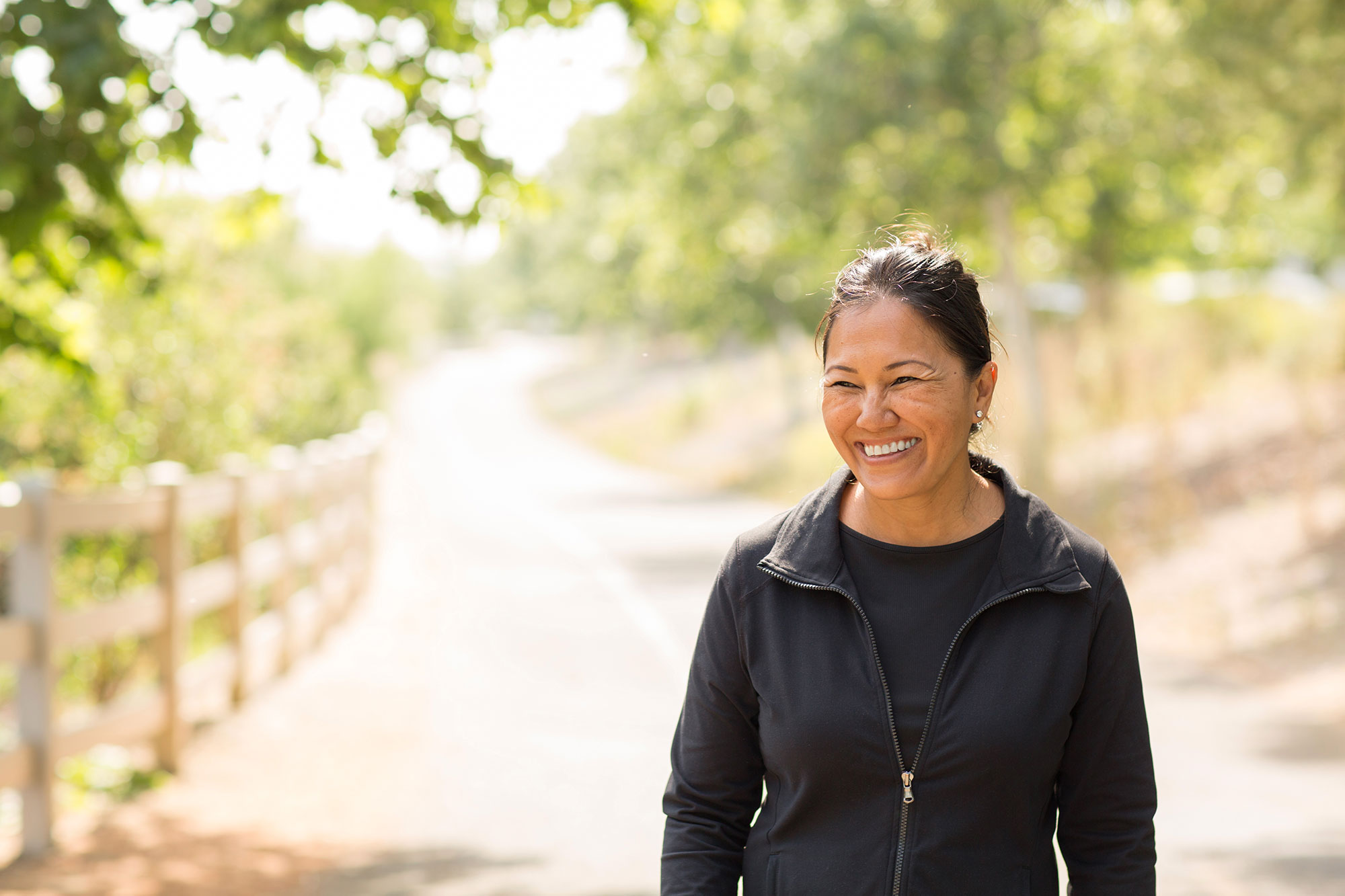 woman-walking-in-forest-smiling