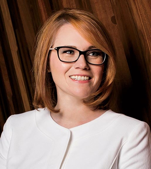 Annie Burridge, seen from the shoulders up, looking slightly toward the right and smiling